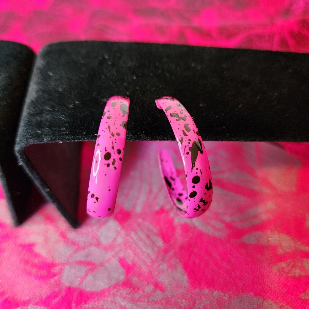 Vibrant Pink and Black Paint Splatter Hoop Earrings.
